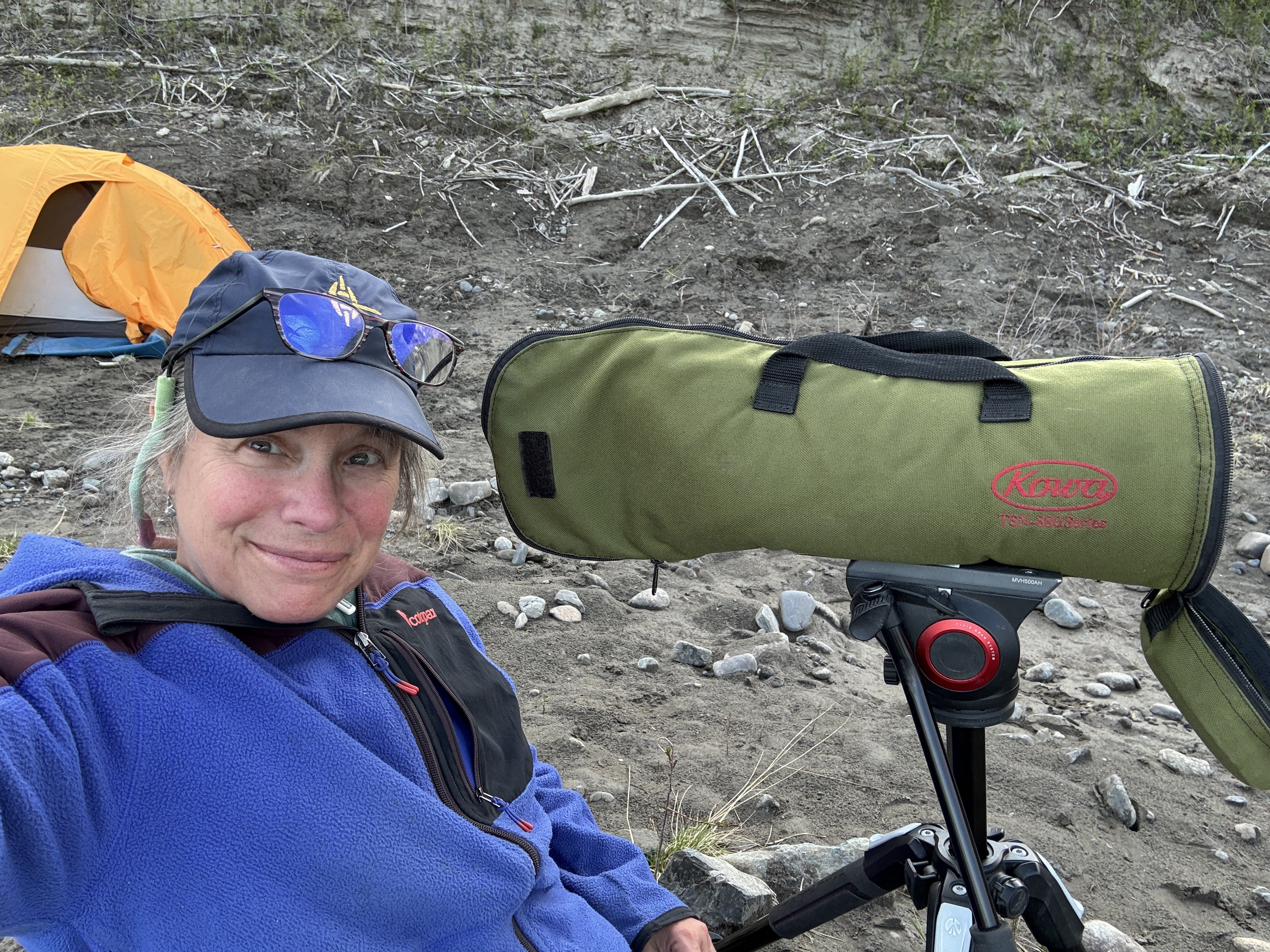 Woman and scope on beach